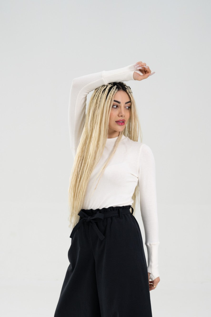 Women wearing a super comfortable and soft off white long sleeve knit shirt with thumbhole details.
Thumbs up Knit Long Sleeve Shirt in cloud by September Archive. Photographed by Paper Crane Creative.