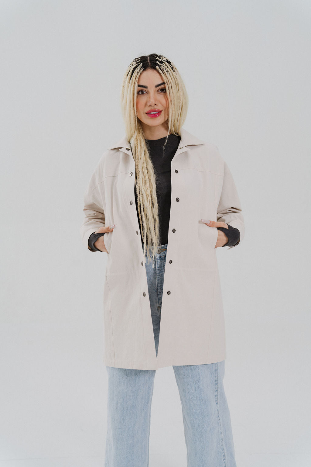 Woman wearing an Atelier Jacket in cloud colorway with light colored jeans.