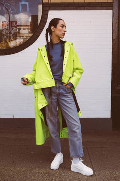 Tearaway City Coat by September Archive. Neon green rain coat. Photographed by Trevor Brady.