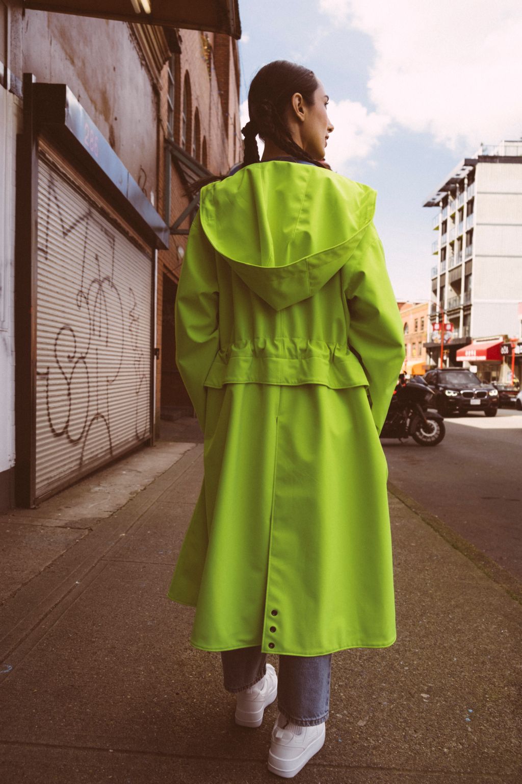 Tearaway City Coat by September Archive. Neon green rain coat. Photographed by Trevor Brady.