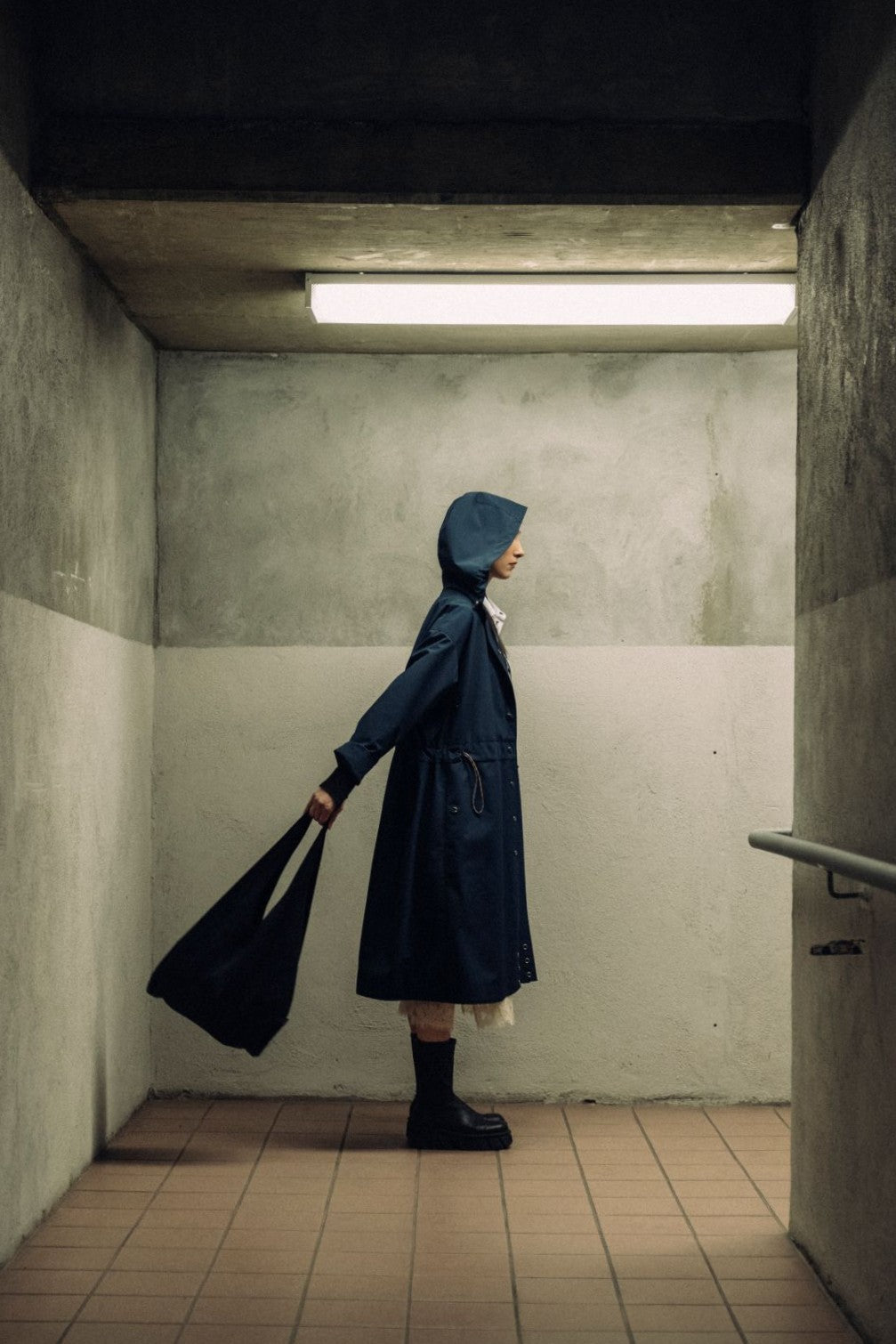 Long City Coat by September Archive. Blue Rain Coat. Photographed by Trevor Brady.