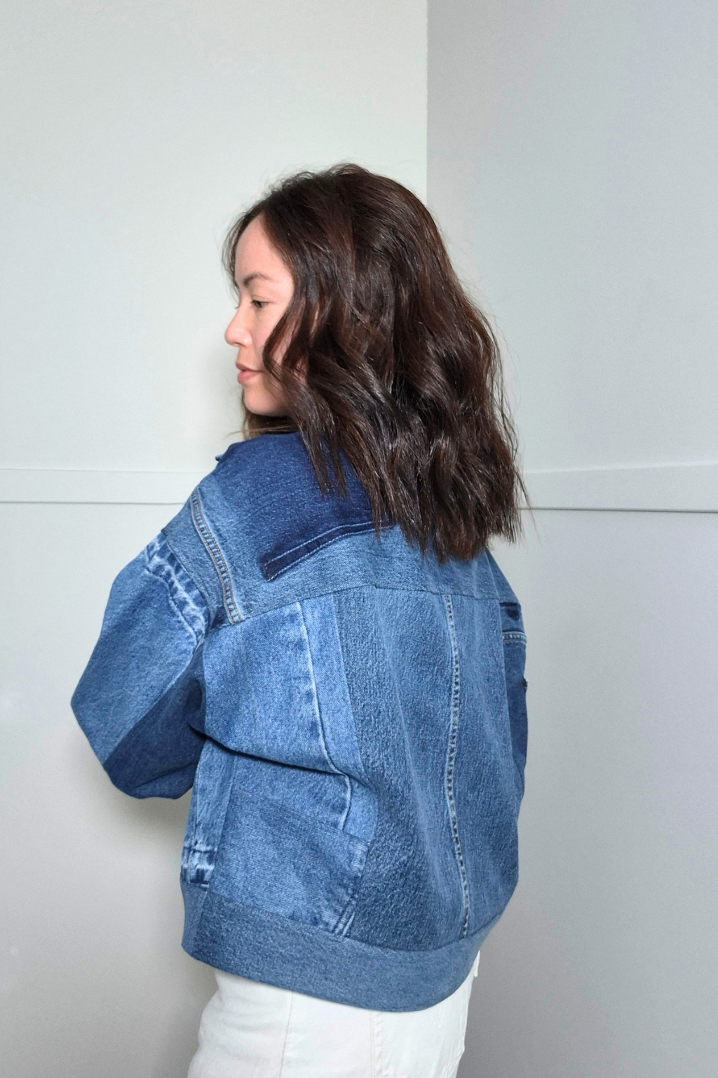 Upcycled denim jacket by September Archive Apparel. Canadian made denim jacket. One of a kind cropped denim jacket made in Vancouver, Canada. Photographed by Sheila Wong. 