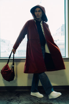 Long City Coat by September Archive. Red Rust Rain Coat. Photographed by Trevor Brady.