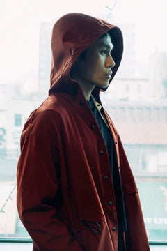 Long City Coat by September Archive. Red Rust Rain Coat. Photographed by Trevor Brady.