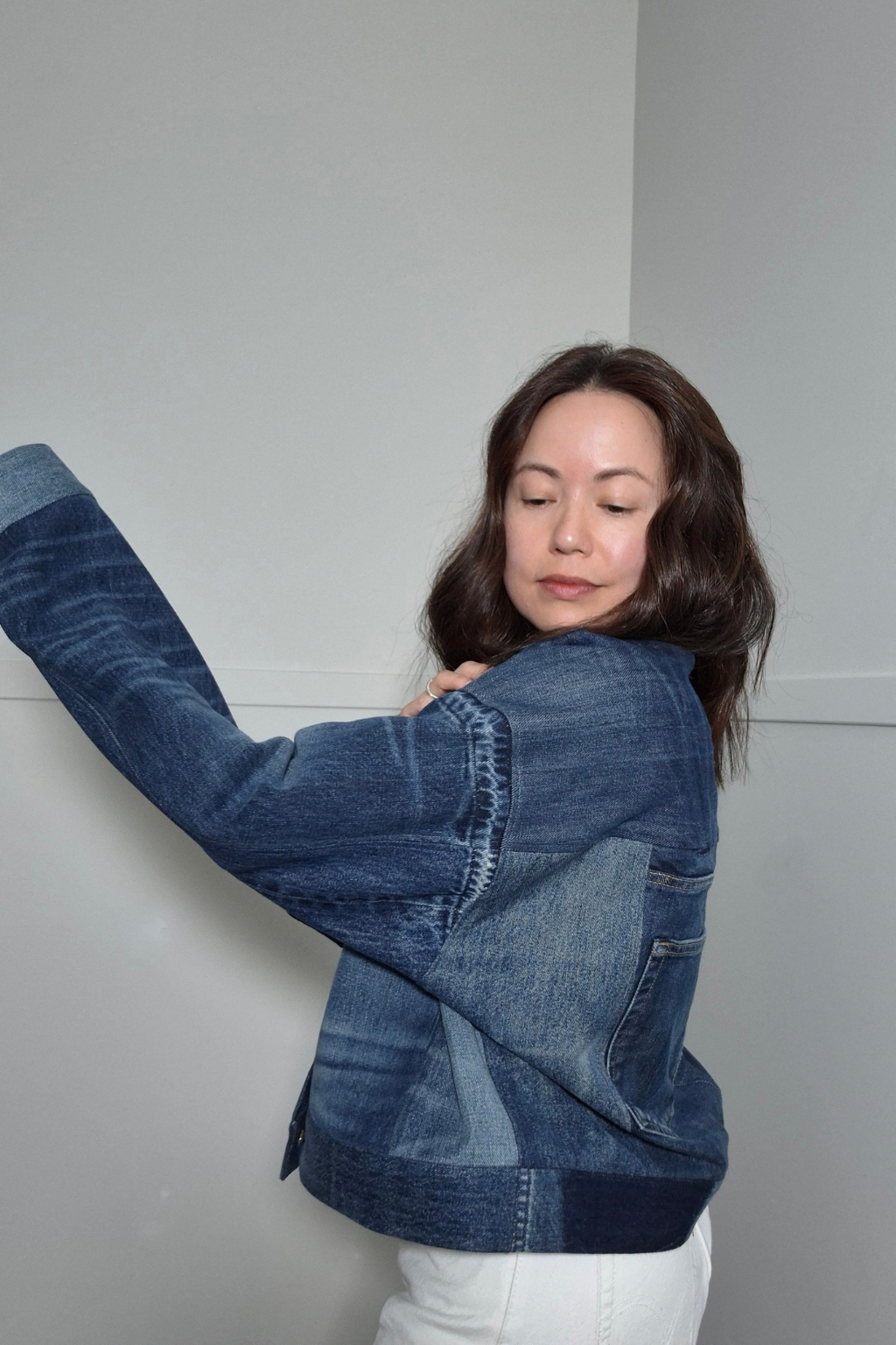 Upcycled denim jacket by September Archive Apparel. Canadian made denim jacket. One of a kind cropped denim jacket made in Vancouver, Canada. Photographed by Sheila Wong. 